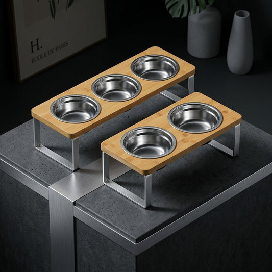Wooden pet feeding station with metal bowls on a dark surface