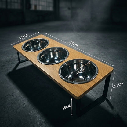 Wooden pet feeder with three bowls and measurements on a dark background