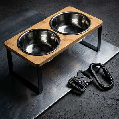 Wooden pet feeder with two metal bowls on a dark surface, accompanied by a black dog leash.